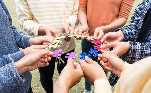 team-lgbtq-rainbow-hand-holding-jigsaw-puzzles-fla-1200px